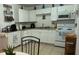 Cozy kitchen with white cabinets and modern appliances at 83 Douglas Way, Frostproof, FL 33843