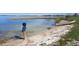 Peaceful lakefront view with a small boat at 83 Douglas Way, Frostproof, FL 33843