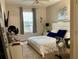 Main bedroom with king bed and window coverings at 13512 Turtle Marsh Loop # 736, Orlando, FL 32837