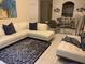 Living room with sectional sofa, decorative rug, and dining area at 13512 Turtle Marsh Loop # 736, Orlando, FL 32837