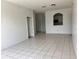 Open living room with tile floors and kitchen pass-through at 13512 Turtle Marsh Loop # 736, Orlando, FL 32837