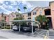 Exterior view showing building and covered parking at 13512 Turtle Marsh Loop # 736, Orlando, FL 32837