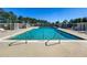 Large community pool with clear blue water and plenty of deck space at 1740 N Hampton Dr, Davenport, FL 33897