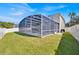 Backyard view of a screened pool and patio area at 1740 N Hampton Dr, Davenport, FL 33897