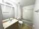 Clean bathroom with a tub, shower and vanity sink at 1928 Drum Dr, Kissimmee, FL 34759