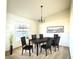 Formal dining room with modern chandelier, a large window and seating for six at 1928 Drum Dr, Kissimmee, FL 34759