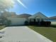 Charming single-story home featuring a well-maintained lawn and a two-car garage at 1928 Drum Dr, Kissimmee, FL 34759