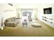 Spacious living room with modern furniture, plush carpeting, and ample natural light at 1928 Drum Dr, Kissimmee, FL 34759