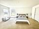 Spacious main bedroom featuring plush carpeting, ample natural light, and neutral tones at 1928 Drum Dr, Kissimmee, FL 34759