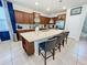 Spacious kitchen features a large island with seating and stainless steel appliances at 2290 Lelani Cir, Davenport, FL 33897