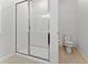 Bathroom with shower stall, toilet, and tiled floor at 331 Ballo Dr, Kissimmee, FL 34746