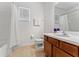 Bathroom with tub shower combo and wood cabinets at 331 Ballo Dr, Kissimmee, FL 34746