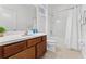 Bathroom with tub shower combo and wood cabinets at 331 Ballo Dr, Kissimmee, FL 34746