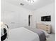 Spacious bedroom with a dresser, TV and double doors at 331 Ballo Dr, Kissimmee, FL 34746