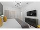 Bedroom with king-size bed, dresser, TV, en-suite bath at 331 Ballo Dr, Kissimmee, FL 34746