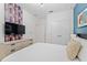 Bright bedroom with a dresser, large TV, and comfortable bed at 331 Ballo Dr, Kissimmee, FL 34746
