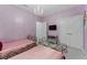 Twin beds in this bedroom with a chandelier and dresser at 331 Ballo Dr, Kissimmee, FL 34746