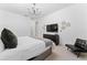 King-size bed, dresser, TV, and comfy chair in this bedroom at 331 Ballo Dr, Kissimmee, FL 34746