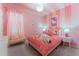 Hello Kitty themed bedroom with a comfy bed and seating at 331 Ballo Dr, Kissimmee, FL 34746