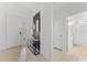 Bright entryway with console table and access to bathroom at 331 Ballo Dr, Kissimmee, FL 34746