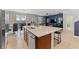Open concept kitchen with island and breakfast bar at 331 Ballo Dr, Kissimmee, FL 34746