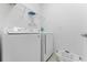 Laundry room with washer, dryer, and shelving at 331 Ballo Dr, Kissimmee, FL 34746