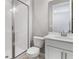 Bathroom with white vanity, glass shower, and gray tile flooring at 4200 Sawtooth Ct, Tavares, FL 32778