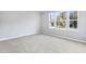 Bright bedroom with neutral walls and carpeted floors at 4200 Sawtooth Ct, Tavares, FL 32778