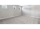 Spacious bedroom with gray walls, carpeting, and multiple windows at 4200 Sawtooth Ct, Tavares, FL 32778