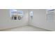 Bright bedroom features tile flooring, large windows, and neutral wall color at 4224 Sawtooth Ct, Tavares, FL 32778