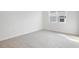 Cozy bedroom with tile floors, window, and neutral wall color scheme at 4224 Sawtooth Ct, Tavares, FL 32778