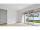 Living room with sliding glass doors, tile floors and ample natural light at 4224 Sawtooth Ct, Tavares, FL 32778