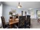 Inviting dining room with a wooden table, upholstered chairs, and decorative lighting at 526 Maricopa Dr, Kissimmee, FL 34758
