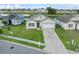 One-story house with a garage and solar panels, well-maintained lawn at 816 William Way, Haines City, FL 33844