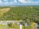 Aerial view of a home and the surrounding wooded neighborhood at 2909 Annalee Rd, Saint Cloud, FL 34771
