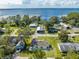 Expansive aerial shot of waterfront homes and neighborhood with scenic lake views showcasing property's location at 2909 Annalee Rd, Saint Cloud, FL 34771