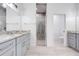 Bright bathroom with marble countertops, tiled floors, and glass enclosed shower at 2909 Annalee Rd, Saint Cloud, FL 34771