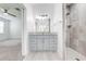 Bathroom featuring grey vanity and shower with tile surround at 2909 Annalee Rd, Saint Cloud, FL 34771