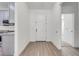 Bright foyer with light wood floors and a white front door, leading to the home's interior at 2909 Annalee Rd, Saint Cloud, FL 34771