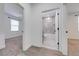Hallway view into bedroom and bathroom with neutral paint at 2909 Annalee Rd, Saint Cloud, FL 34771