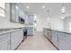 Kitchen with stainless steel appliances, granite countertops, ample cabinet space, and wood-look flooring at 2909 Annalee Rd, Saint Cloud, FL 34771