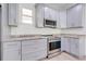 Kitchen with stainless steel appliances, granite countertops, and ample cabinet space at 2909 Annalee Rd, Saint Cloud, FL 34771