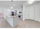 Kitchen featuring island sink, stainless steel appliances, granite countertops, and access to laundry room at 2909 Annalee Rd, Saint Cloud, FL 34771
