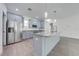 Kitchen with stainless steel appliances, granite countertops, ample cabinet space, and stylish pendant lighting at 2909 Annalee Rd, Saint Cloud, FL 34771
