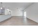 Spacious living room with wood-look flooring, ceiling fan, and natural light from the sliding glass door at 2909 Annalee Rd, Saint Cloud, FL 34771