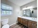 Bathroom with double vanity and large mirror at 32122 Hickory Ln, Sorrento, FL 32776