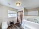 Bathroom with soaking tub and shower at 32122 Hickory Ln, Sorrento, FL 32776