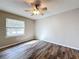 Bright bedroom with ceiling fan and window at 32122 Hickory Ln, Sorrento, FL 32776
