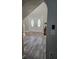 Bright entryway with double doors and wood-look flooring at 32122 Hickory Ln, Sorrento, FL 32776