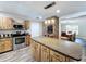 Modern kitchen with stainless steel appliances and wooden cabinets at 32122 Hickory Ln, Sorrento, FL 32776